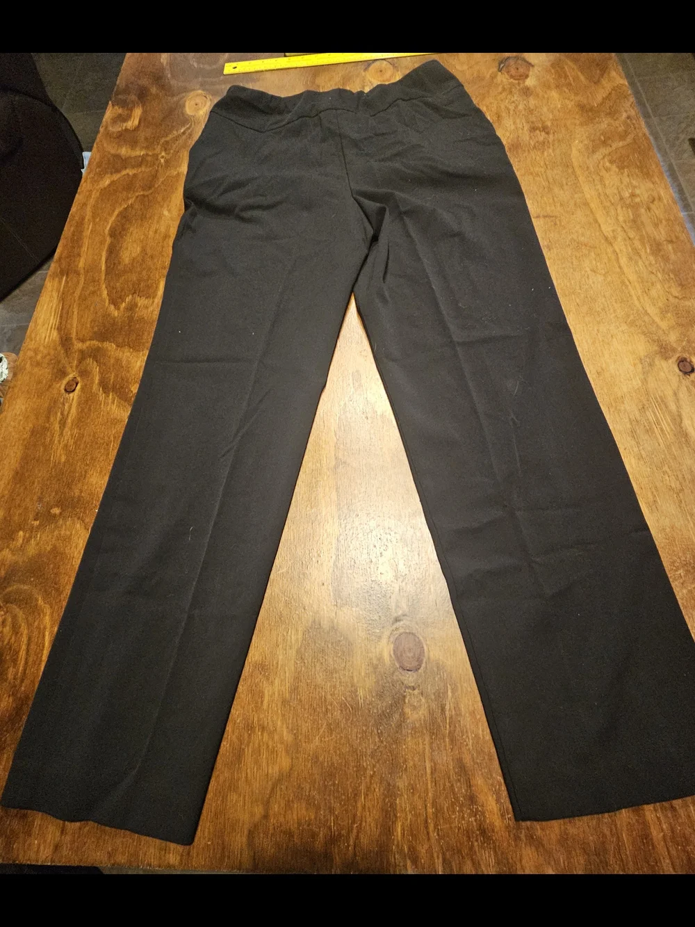 C3, The product is a pair of black dress pants for women by the brand Investment